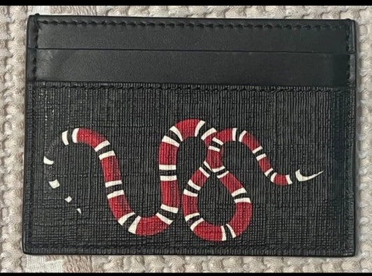 Black card holder with red and white snake graphic